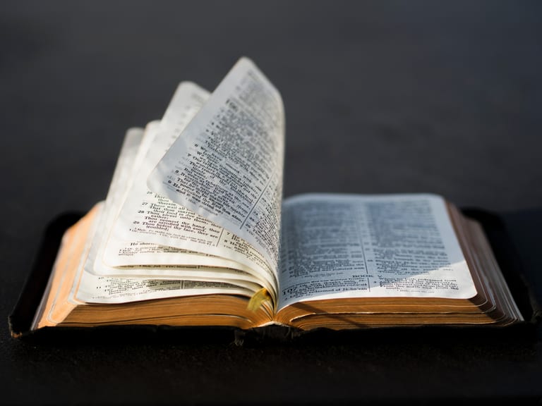 Bible open to a passage about the crucifixion of Jesus Christ