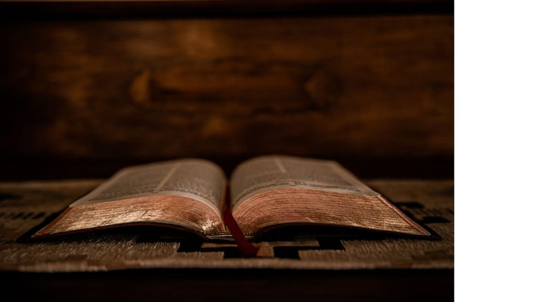 Pastor preparing a Good Friday sermon with an open Bible