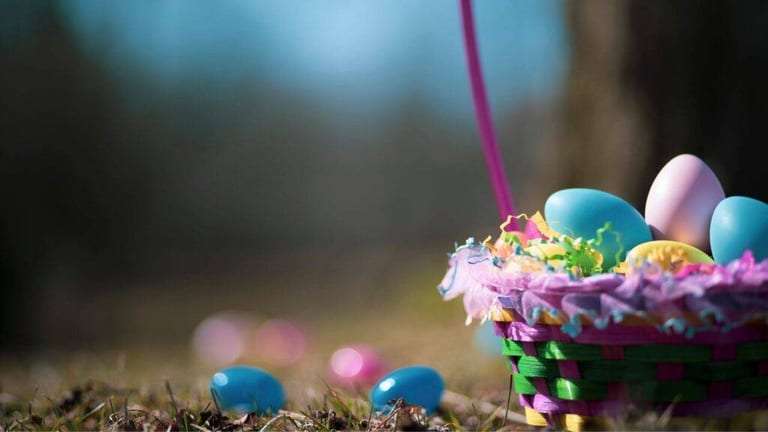 Volunteers organizing a community Easter egg hunt in a neighborhood park