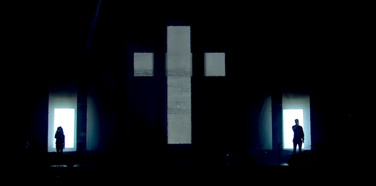 Easter Sunday stage design with dramatic lighting and cross backdrop at Elevation Church
